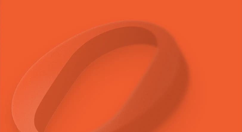 A soft 3D bronze ring resting on its side
