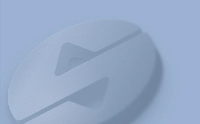 A rounded 3D silver disc with a folded edge